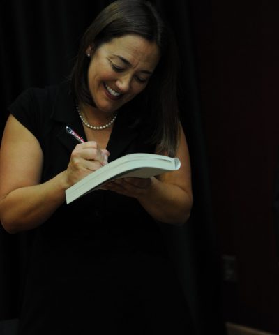 photo of Erin Gruwell signing a book